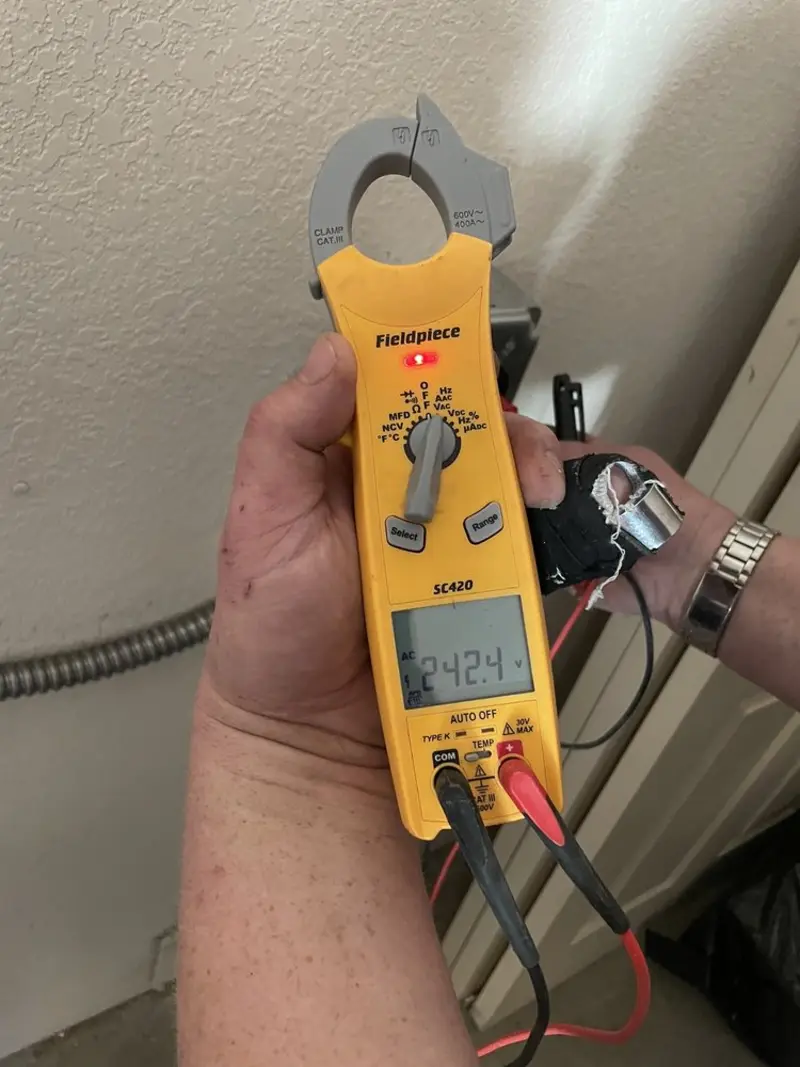 Voltage testing with clamp meter during Ceiling Fan Installation in Mendon